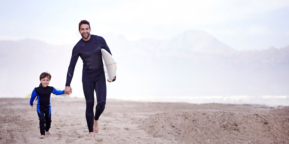 Good Father Walking On The Beach With Son